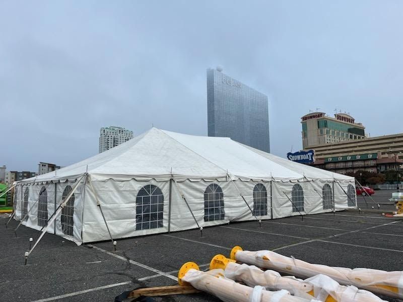 Large white tent with sidewalls set up in Atlantic City parking lot near Showboat casino