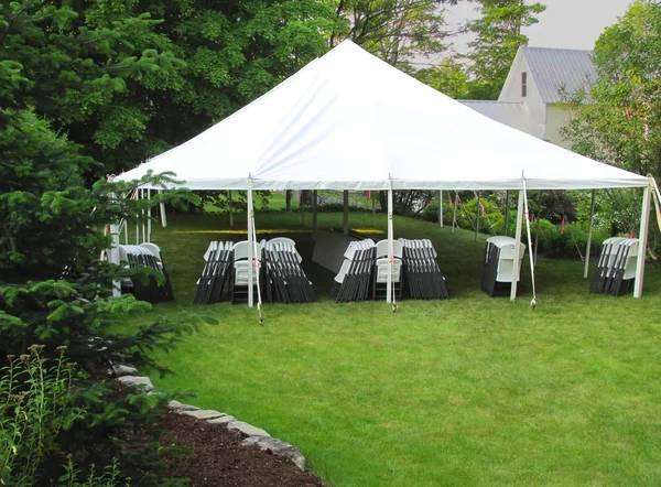 White frame tent set up on green lawn - Tents For Rent & Party Supply